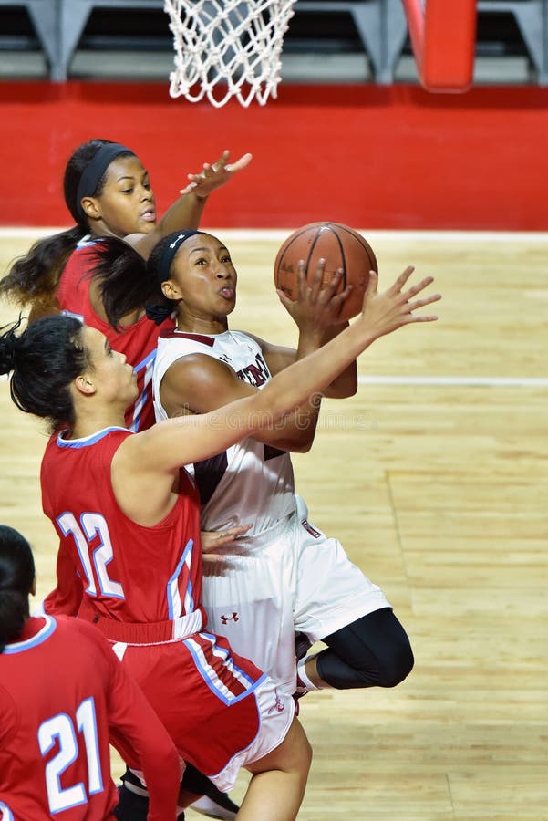Temple Owls guard ALLIYA BUTTS (0) drives by Delaware State Hornets guard/forward BOBBI FLOYD (12) during the NCAA women's basketball game played at the Liacouras Center in Philadelphia. Temple Owls guard ALLIYA BUTTS (0) drives by Delaware State Hornets guard/forward BOBBI FLOYD (12) during the NCAA women's basketball game played at the Liacouras Center in Philadelphia.