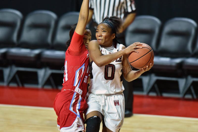 Temple Owls guard ALLIYA BUTTS (0) drives to the basket past Delaware State Hornets guard ALIAH STINNETT (21) during the NCAA women's basketball game played at the Liacouras Center in Philadelphia. Temple Owls guard ALLIYA BUTTS (0) drives to the basket past Delaware State Hornets guard ALIAH STINNETT (21) during the NCAA women's basketball game played at the Liacouras Center in Philadelphia.