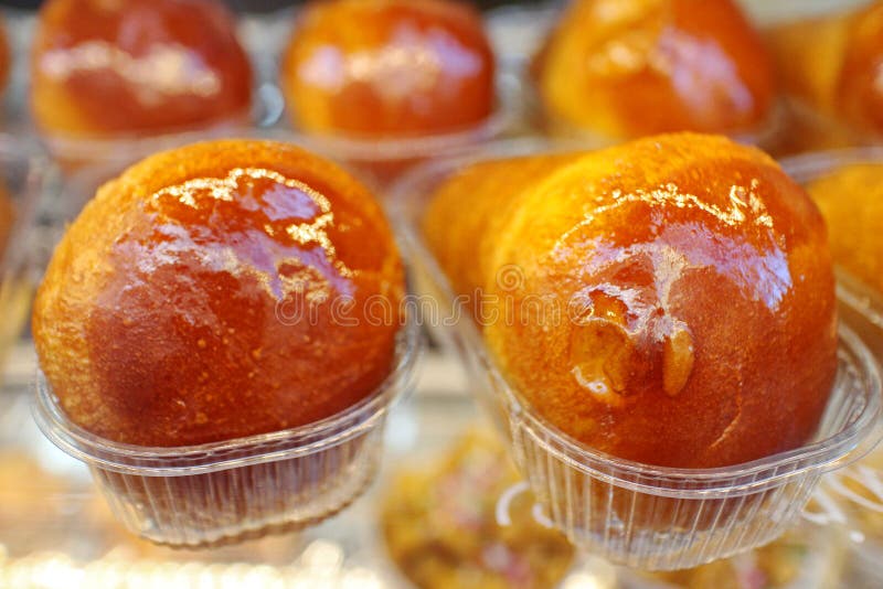 Baba, a typical Neapolitan pastry, made from flour, butter, sugar, yeast and eggs. Usually impregnated with liquor rum. Baba, a typical Neapolitan pastry, made from flour, butter, sugar, yeast and eggs. Usually impregnated with liquor rum.