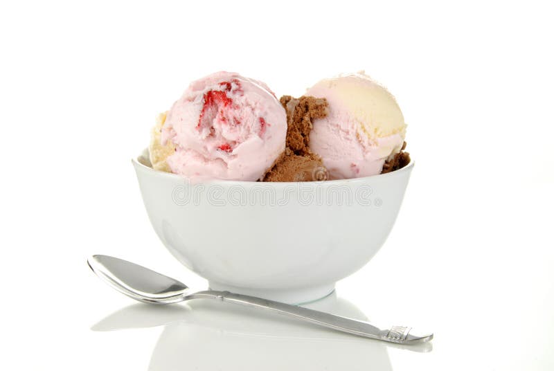 A bowl of neapolitan ice cream on white. A bowl of neapolitan ice cream on white