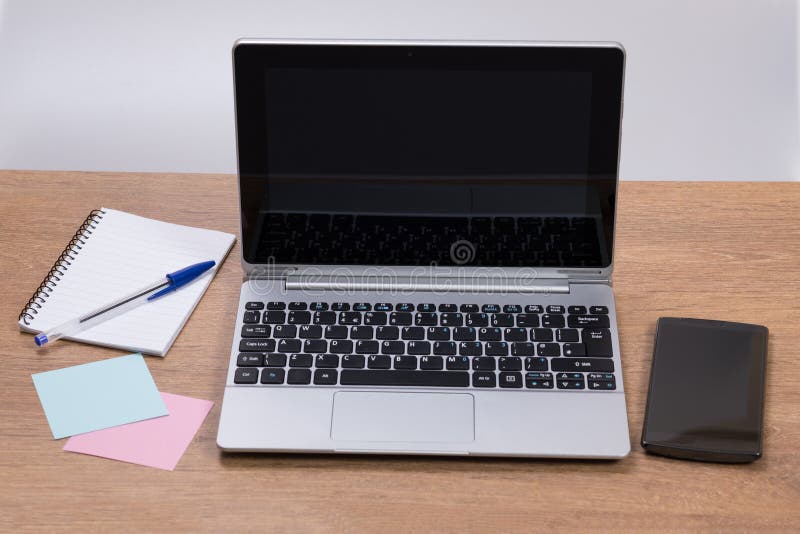 Neat workstation in an office with laptop stock photography Neat workstation in an office with laptop stock photography