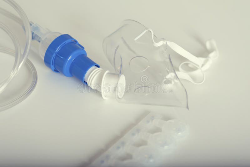 Nebulizer Mask and Ampules on a Table. Inhalation Treatment. Stock