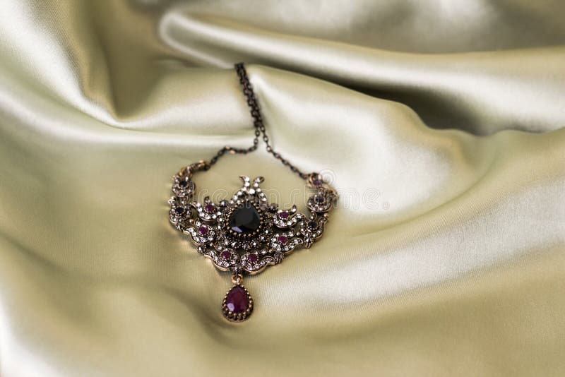 Necklace on Light Satin. Ancient Decoration of the Ottoman Empire Stock