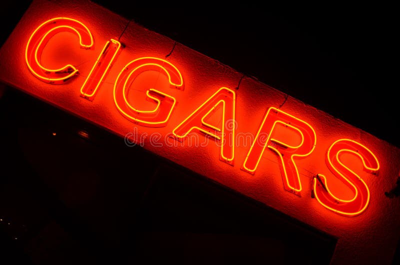 A dutch angle shot of a neon light \"CIGARS\" signage. A dutch angle shot of a neon light \"CIGARS\" signage