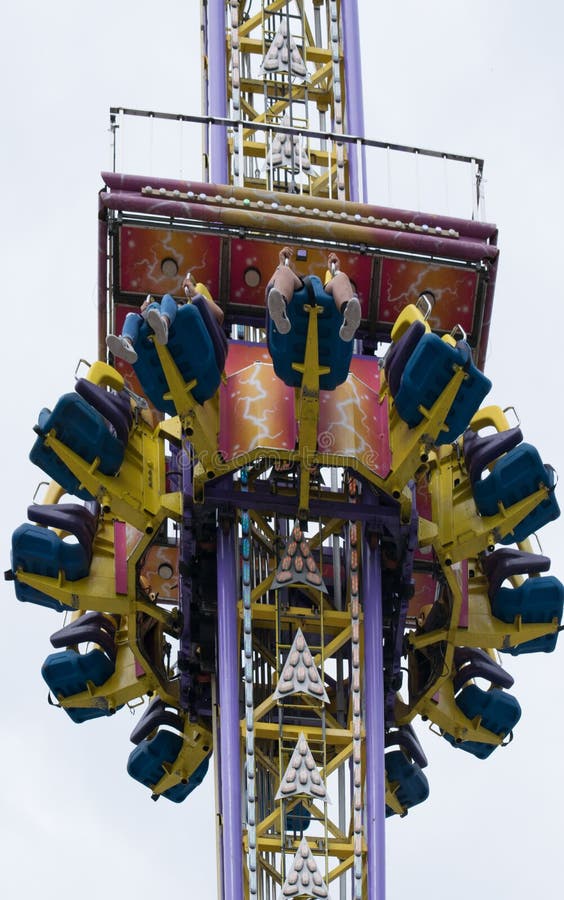 Four Feet Dangle from the Needle Drop Sky Ride at the State Fair the