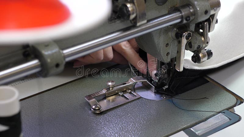 Process Of Sewing Leather Goods. The Needle Of The Sewing Machine In A Sewing Machine Needle Moves Up And Down