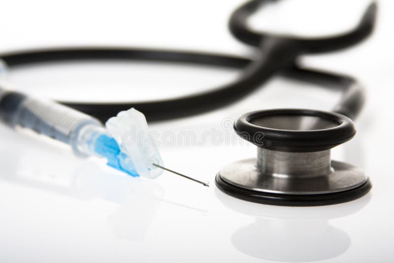 Needle and stethoscope stock image