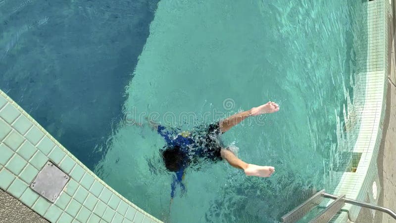 Negeri Sembilan, Malaysia - Aug 3, 2023 Asian little girl swimming in mermaid style. vertical._3840x2160_prob-3.mp4