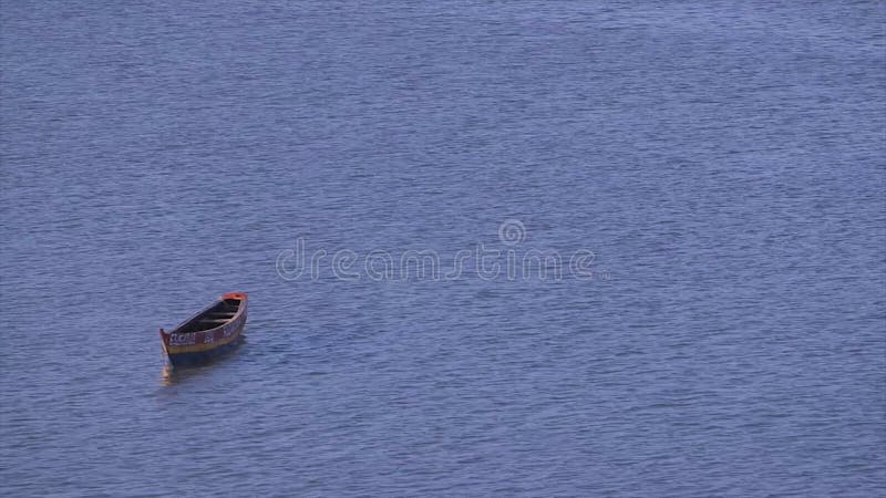 Neglected empty boat floating, Conakry, Guinea