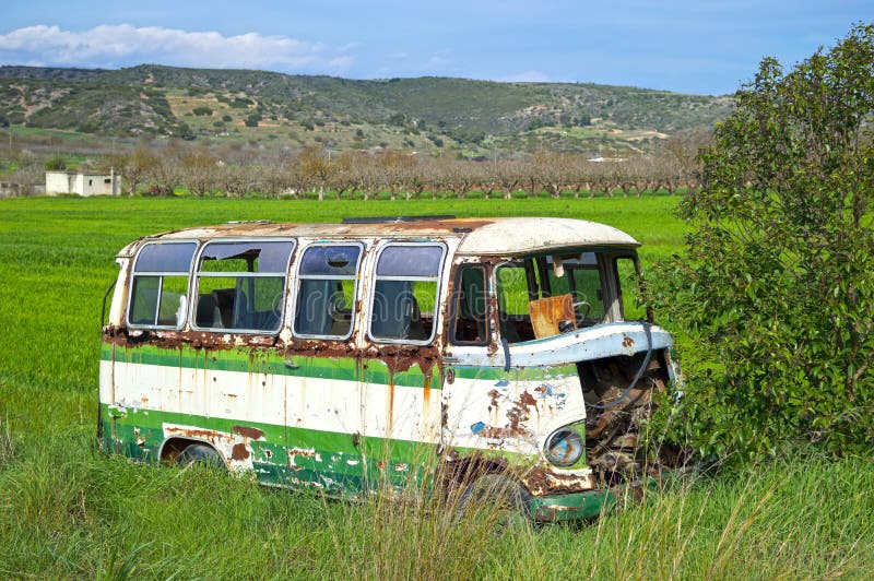 Neglected micro-bus. View of an old neglected micro-bus in a field. Neglected micro bus stock images, royalty-free photos and pictures