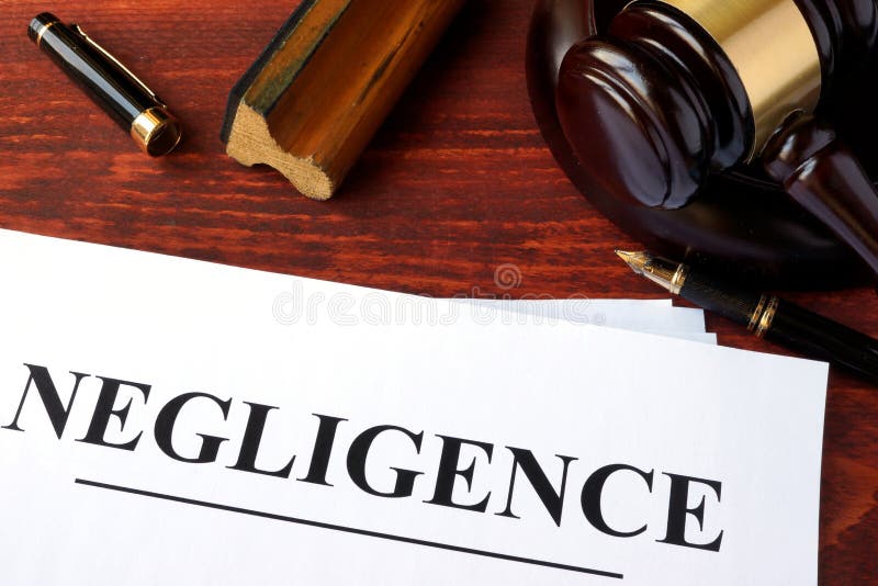 Negligence form and gavel on a table. stock photos
