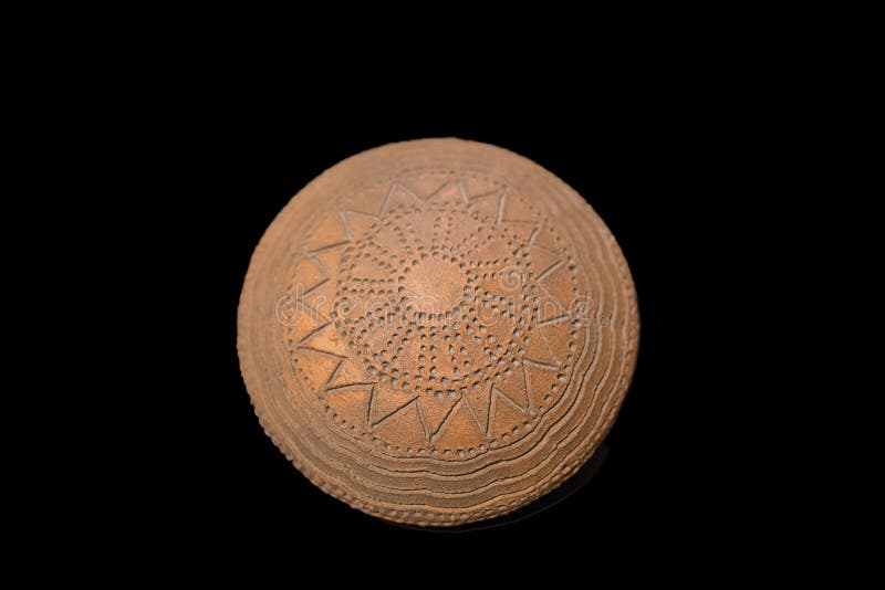 Madrid, Spain - November 11, 2017: Neolithic bowl made with geometrical incised decoration at National Archeological Museum of Madrid, Spain. Madrid, Spain - November 11, 2017: Neolithic bowl made with geometrical incised decoration at National Archeological Museum of Madrid, Spain