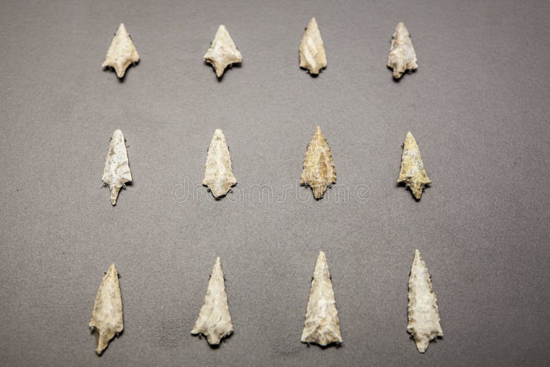 Madrid, Spain - February 24, 2017: neolithic stone arrowheads, at National Archeological Museum of Madrid. Madrid, Spain - February 24, 2017: neolithic stone arrowheads, at National Archeological Museum of Madrid