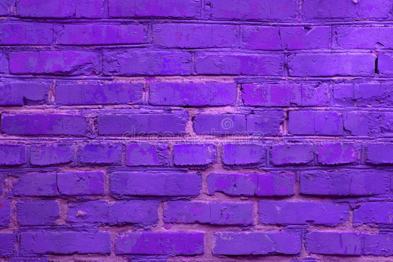 Neon ultra violet colored brick wall background. Horizontal toned backdrop. Disco violet light stock images, royalty-free photos and pictures