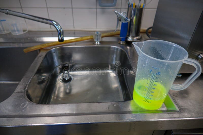 Neon Green Liquid is Put into a Water Bath Stock Photo Image of white