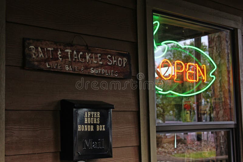 Neon Open Sign in Window of Rural Bait and Tackle Shop Editorial