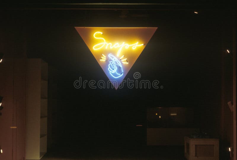 A neon sign that reads �Snaps� stock photos