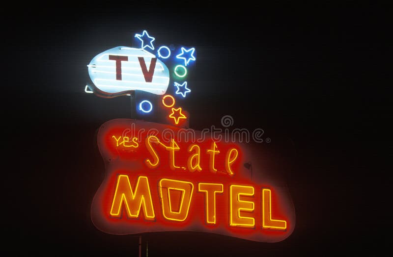 A neon sign that reads �State Motel� royalty free stock image