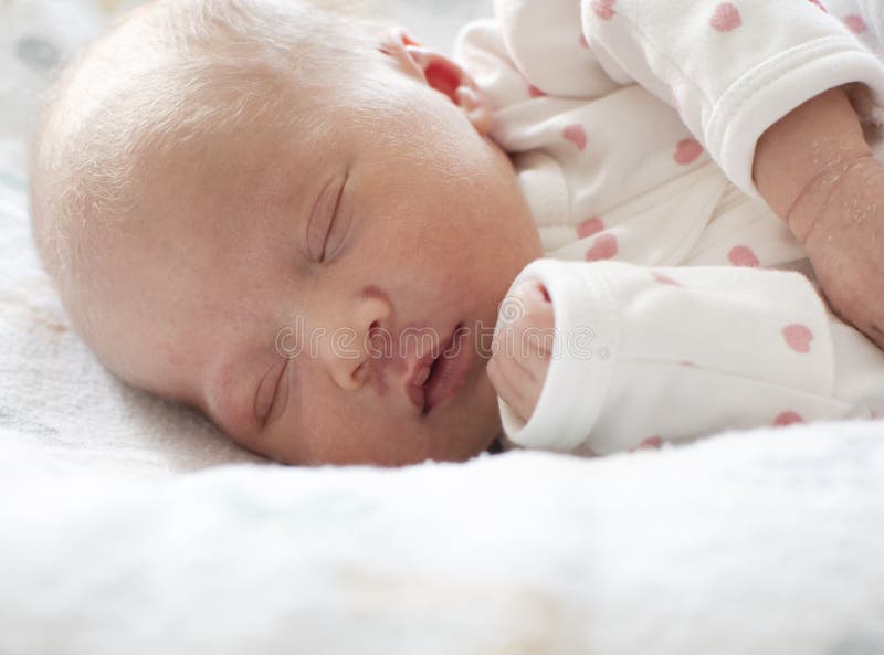 Little newborn sleeping preemie baby with a birthmark. Caucasian infant baby sleeping. Little newborn sleeping preemie baby with a birthmark. Caucasian infant baby sleeping