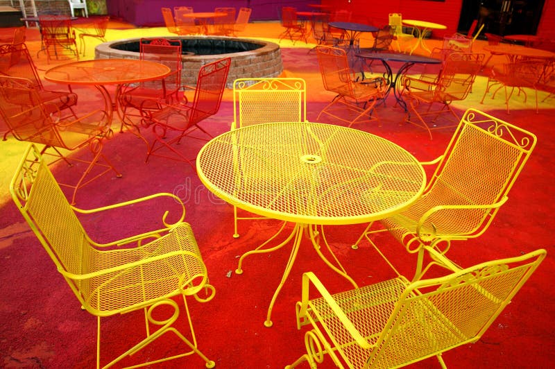 Brightly painted outdoor furniture on the patio of a bar in Des Moines, Iowa. Brightly painted outdoor furniture on the patio of a bar in Des Moines, Iowa.