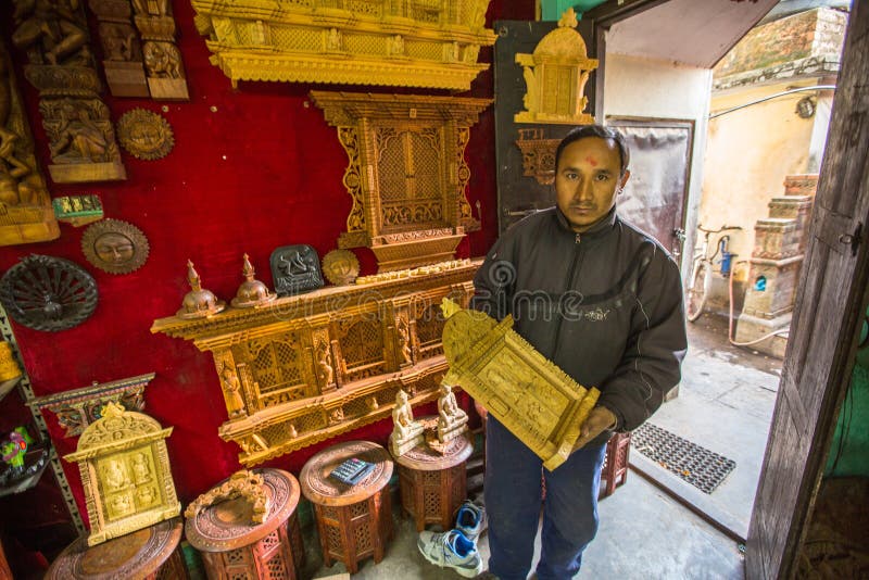 Nepalese man working in his wooden workshop royalty free stock photography