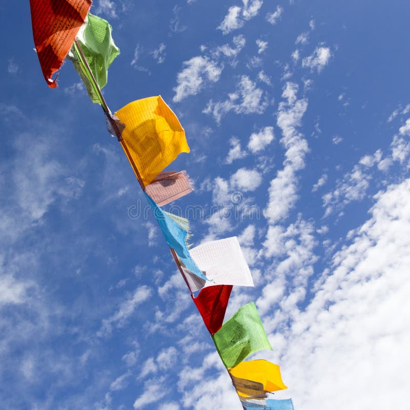 Nepalese Prayer Flags Against the Blue Sky. Stock Photo Image of