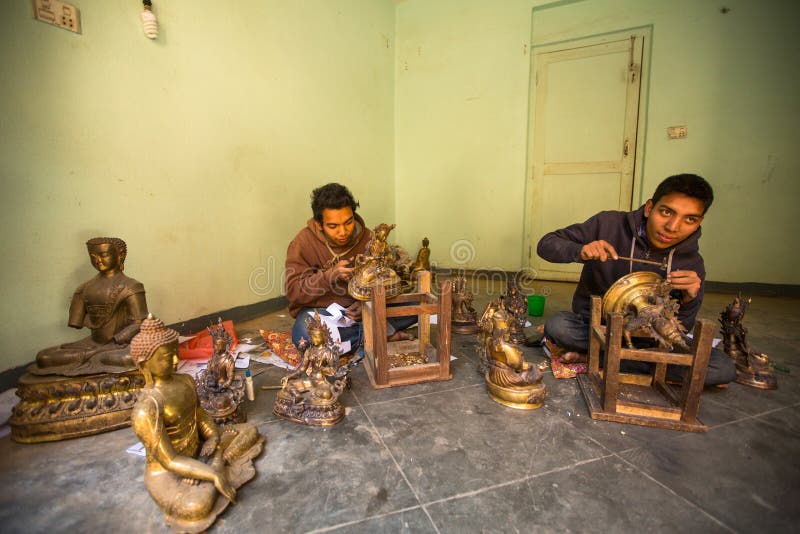 Nepalese tinman working in the his workshop royalty free stock photos