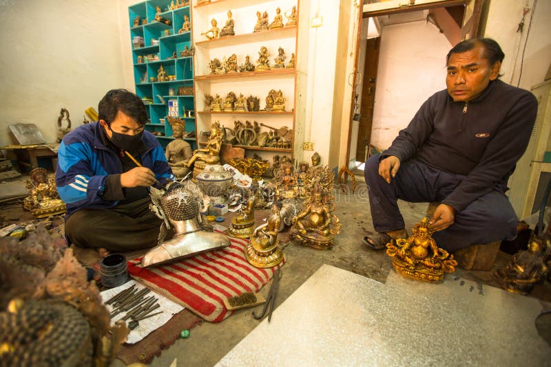 Nepalese tinman working in the his workshop, in Bhaktapur, Nepal. royalty free stock photography