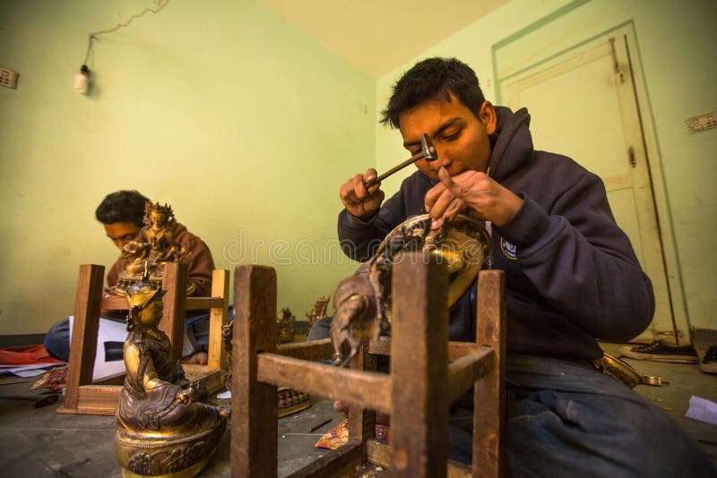 Nepalese tinman working in the his workshop, in Bhaktapur, Nepal. stock images