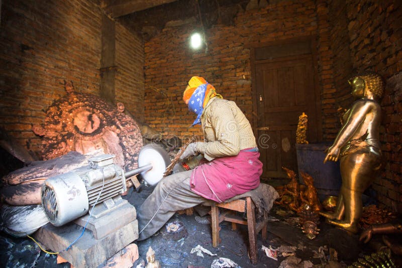 Nepalese tinmans working in the his workshop. More 100 cultural groups have created an image Bhaktapur as Capital of Nepal Arts. stock photo