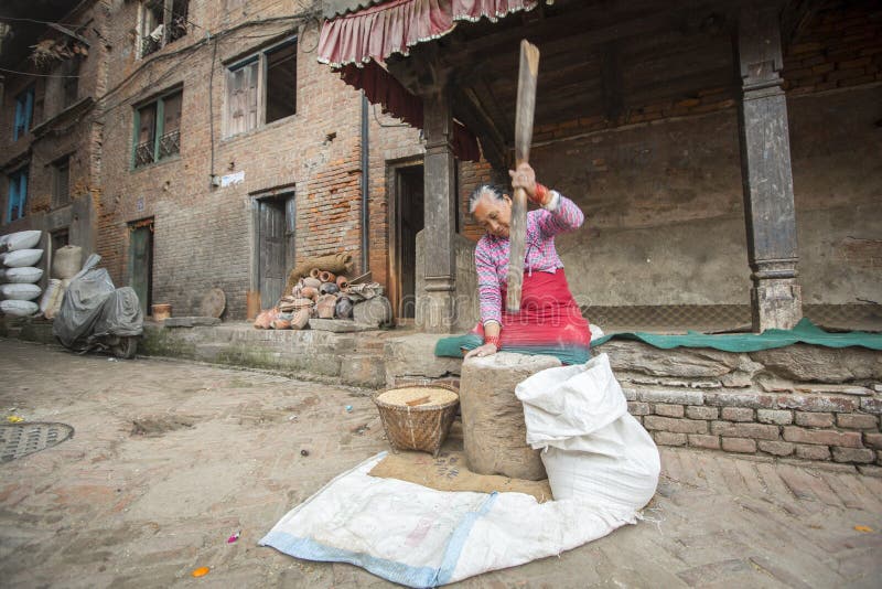 Nepalese woman working in the his pottery workshop. royalty free stock image