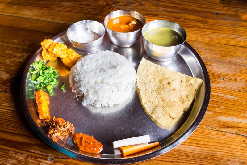 Nepali Thali meal set with curry chicken stock photos Nepali Thali meal set with curry chicken stock photos