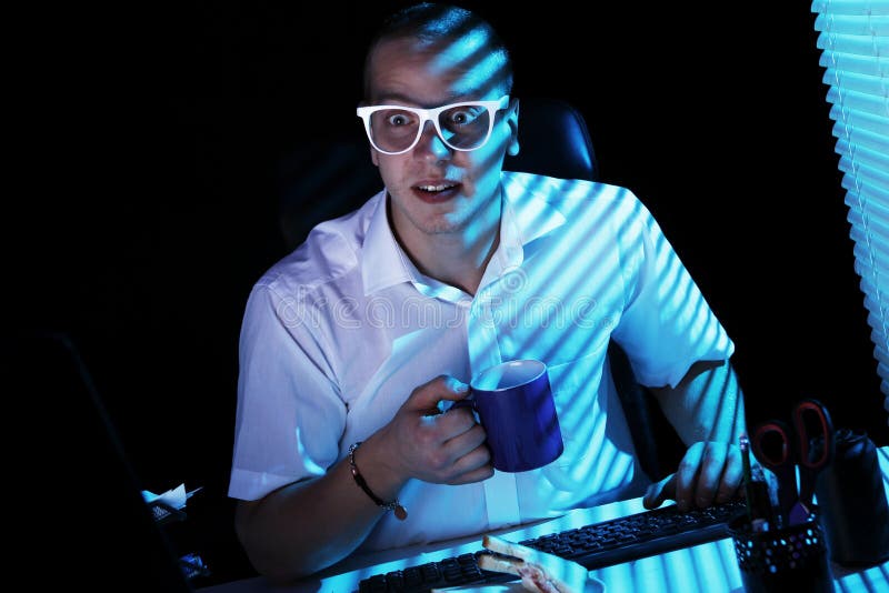Nerd surfing internet at night time