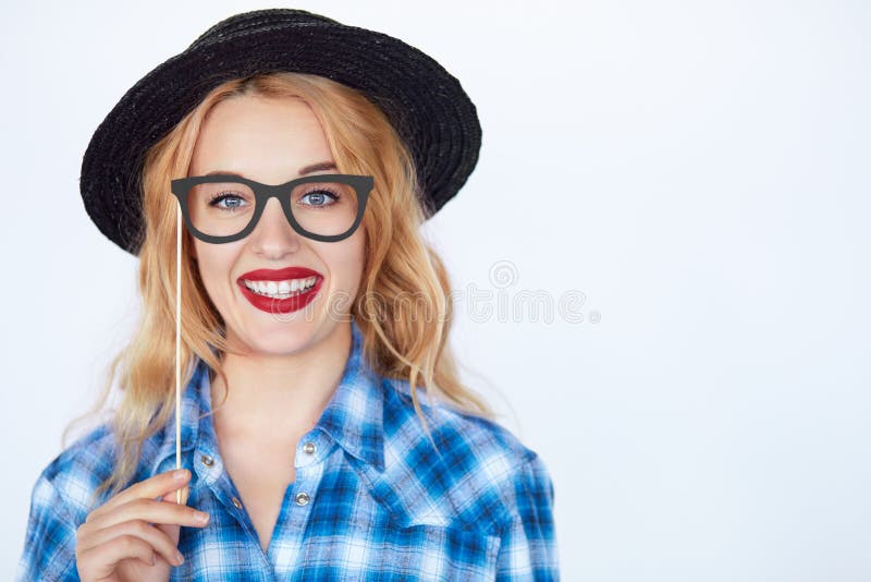 Nerdy fashion hipster wearing a hat and blue shirt