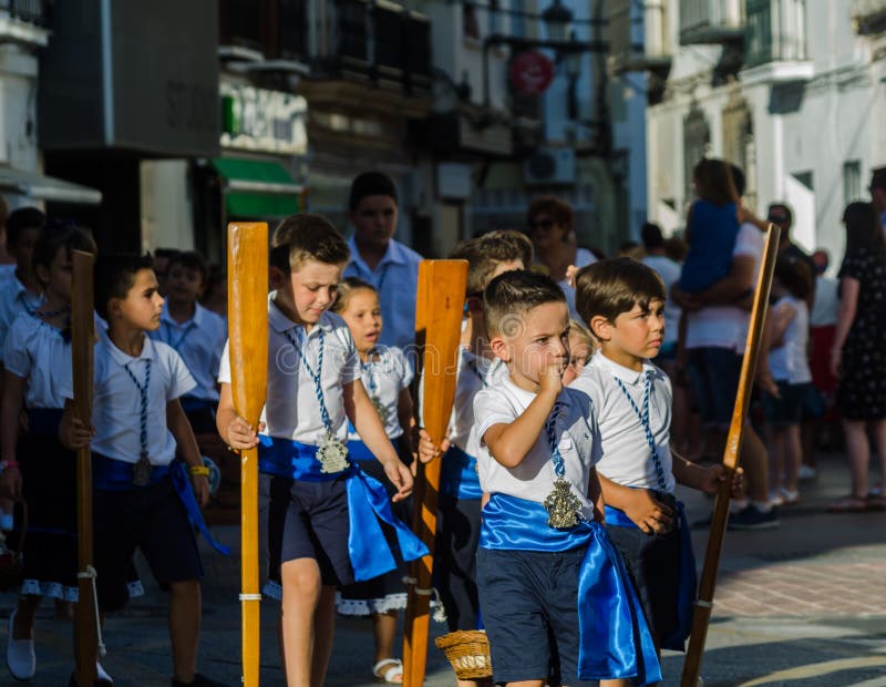 NERJA, SPAIN - JULY 16, 2018 annual parade in the coastal Andalusian town on the occasion of a pilgrimage with the sculpture royalty free stock photo NERJA, SPAIN - JULY 16, 2018 annual parade in the coastal Andalusian town on the occasion of a pilgrimage with the sculpture royalty free stock photo