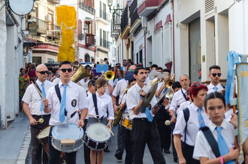 NERJA, SPAIN - JULY 16, 2018 annual parade in the coastal Andalusian town on the occasion of a pilgrimage with the sculpture stock photo NERJA, SPAIN - JULY 16, 2018 annual parade in the coastal Andalusian town on the occasion of a pilgrimage with the sculpture stock photo