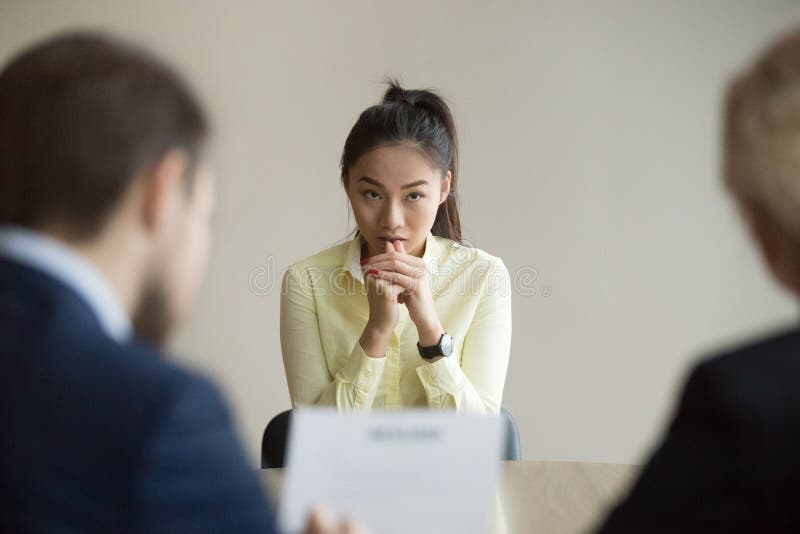 Nervous Asian applicant stressed at job interview royalty free stock photos Nervous Asian applicant stressed at job interview royalty free stock photos