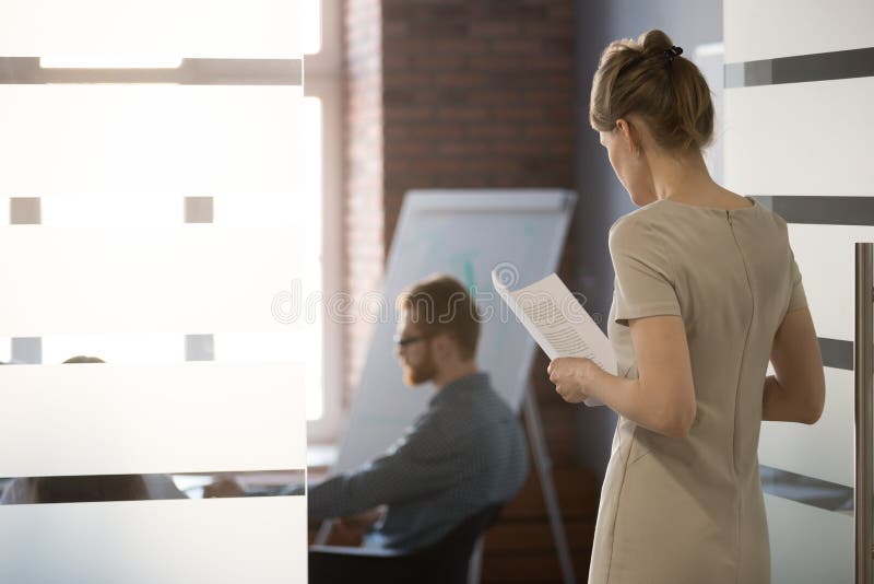 Nervous female employee scared join team meeting in office royalty free stock image Nervous female employee scared join team meeting in office royalty free stock image