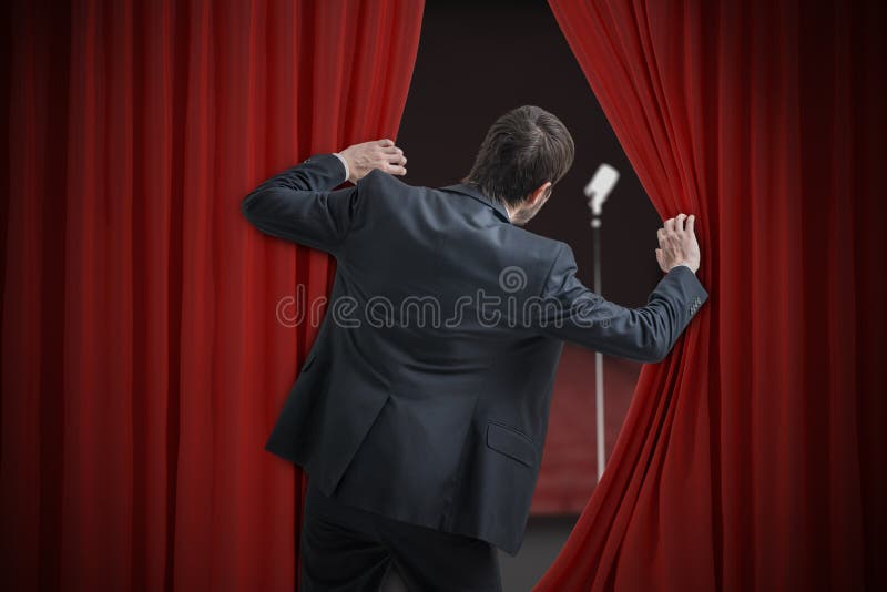 Nervous man is afraid of public speech and is hiding behind curtain