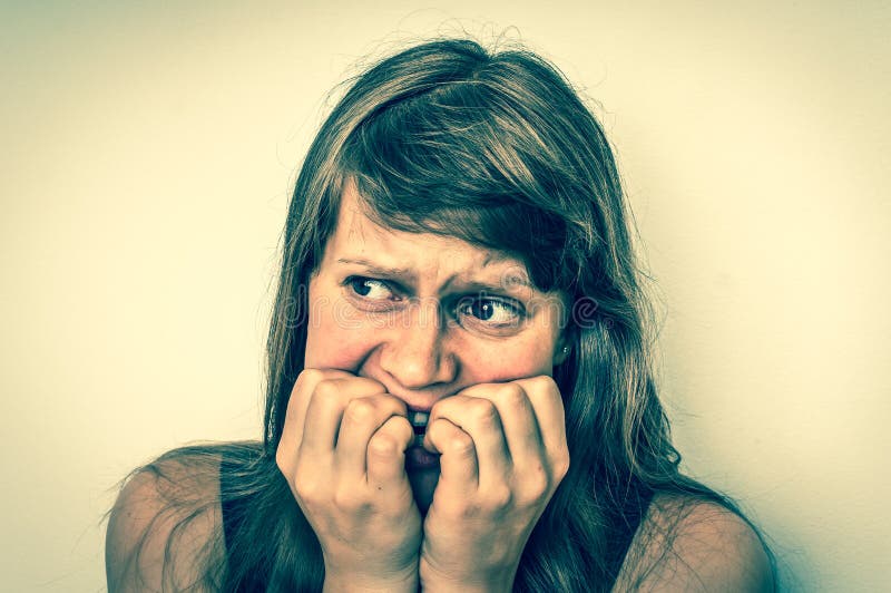 Nervous woman biting her nails - retro style royalty free stock photography Nervous woman biting her nails - retro style royalty free stock photography