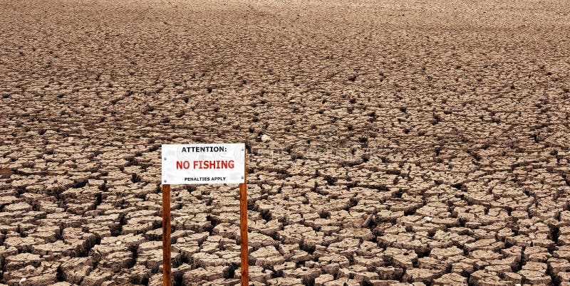 Comical no fishing sign on a dry lake bed. Comical no fishing sign on a dry lake bed