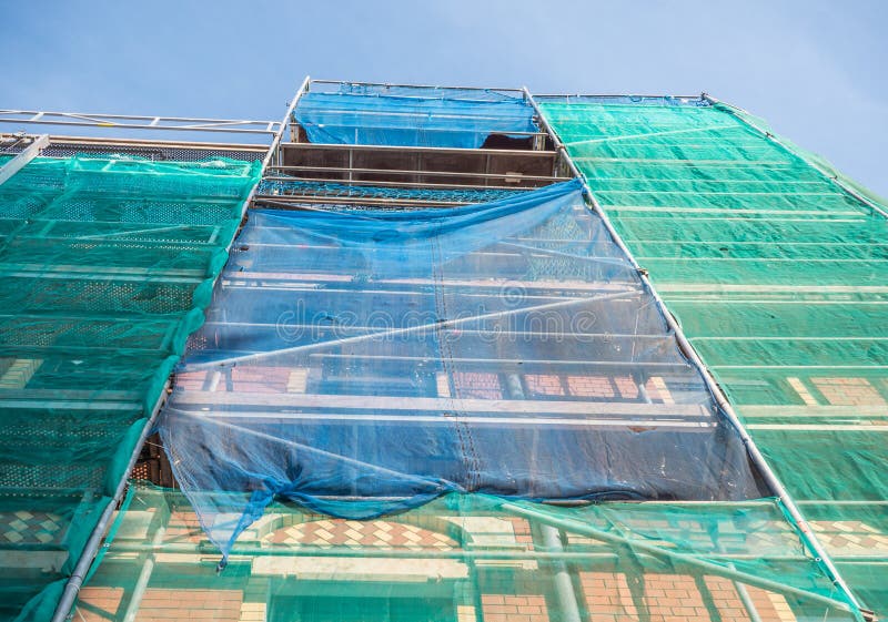 Net on the scaffold for safety royalty free stock photo