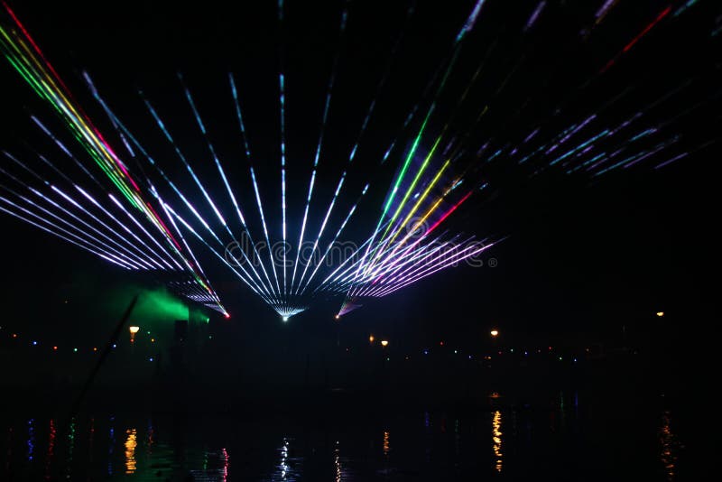 Laser show during public free event on public street and water with small ships parad royalty free stock photography Laser show during public free event on public street and water with small ships parad royalty free stock photography