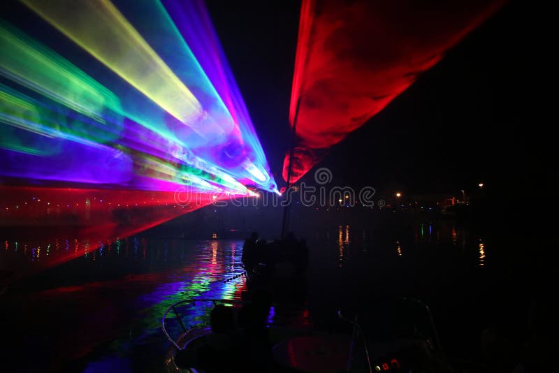 Laser show during public free event on public street and water with small ships parad royalty free stock images Laser show during public free event on public street and water with small ships parad royalty free stock images