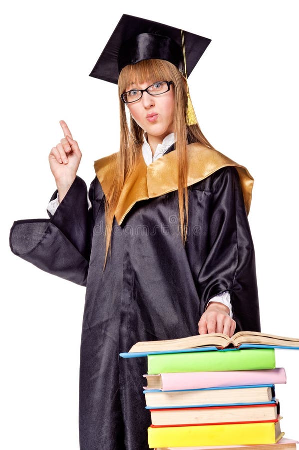 Cute young woman in a graduation gown. Isolated over white. Cute young woman in a graduation gown. Isolated over white