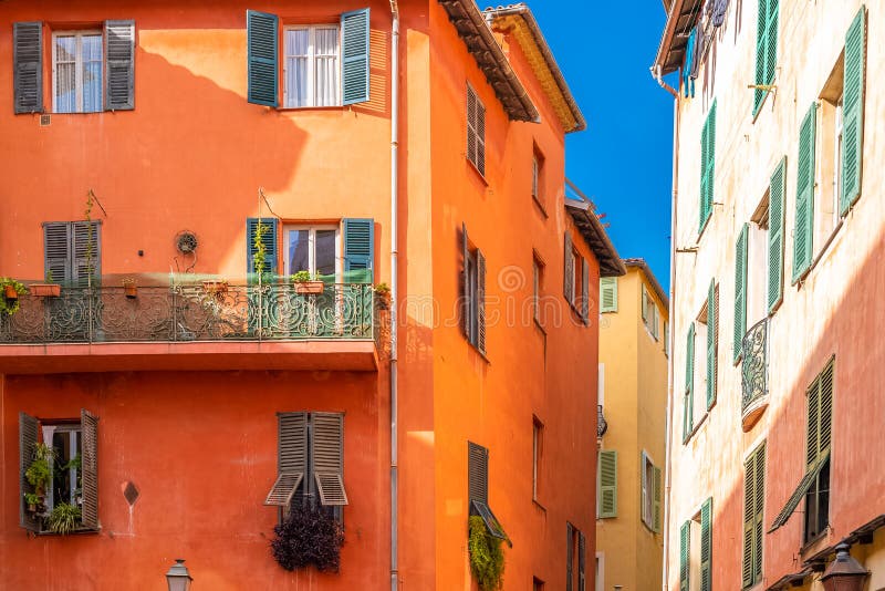 Nice, narrow street in the Vieux Nice, ancient buildings, typical facades in the old town, French Riviera. Nice, narrow street in the Vieux Nice, ancient buildings, typical facades in the old town, French Riviera