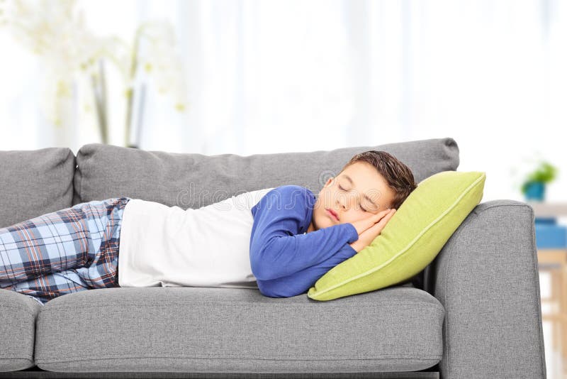 Cute little boy sleeping on sofa at home. Cute little boy sleeping on sofa at home