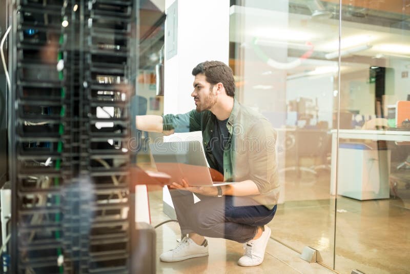 Network administrator in server room royalty free stock photos