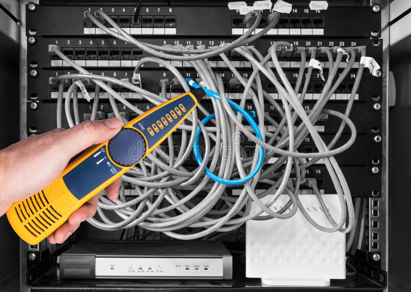 Professional measurement of structured cabling in patch panels of rack case by yellow device. IT service. Professional measurement of structured cabling in patch panels of rack case by yellow device. IT service