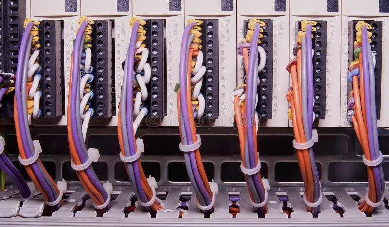 Network cables connected to switch - close up of data center hardware. Multi colored wires stock images Network cables connected to switch - close up of data center hardware. Multi colored wires stock images
